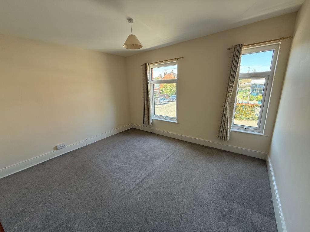 Lot: 116 - END-TERRACE HOUSE WITH PARKING - Bedroom one with 2 window to front